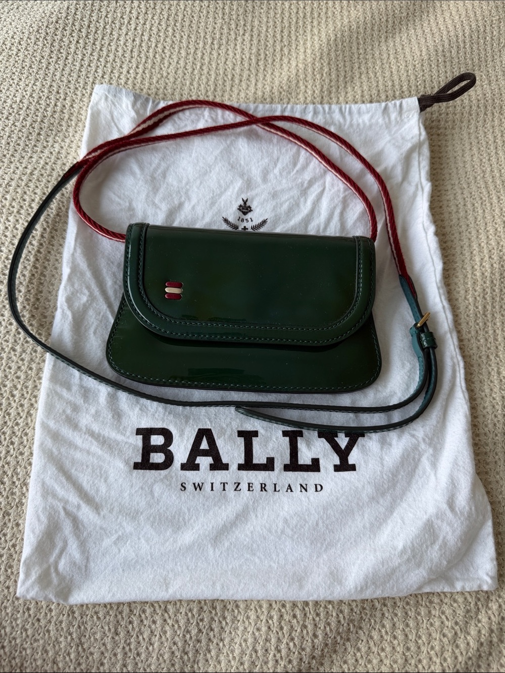 Bally Dark Green Patent Leather Crossbody with Red Strap Accent